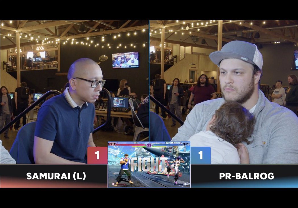 Dad Wins Championship in Kombat 6 Competition with Sleeping Child